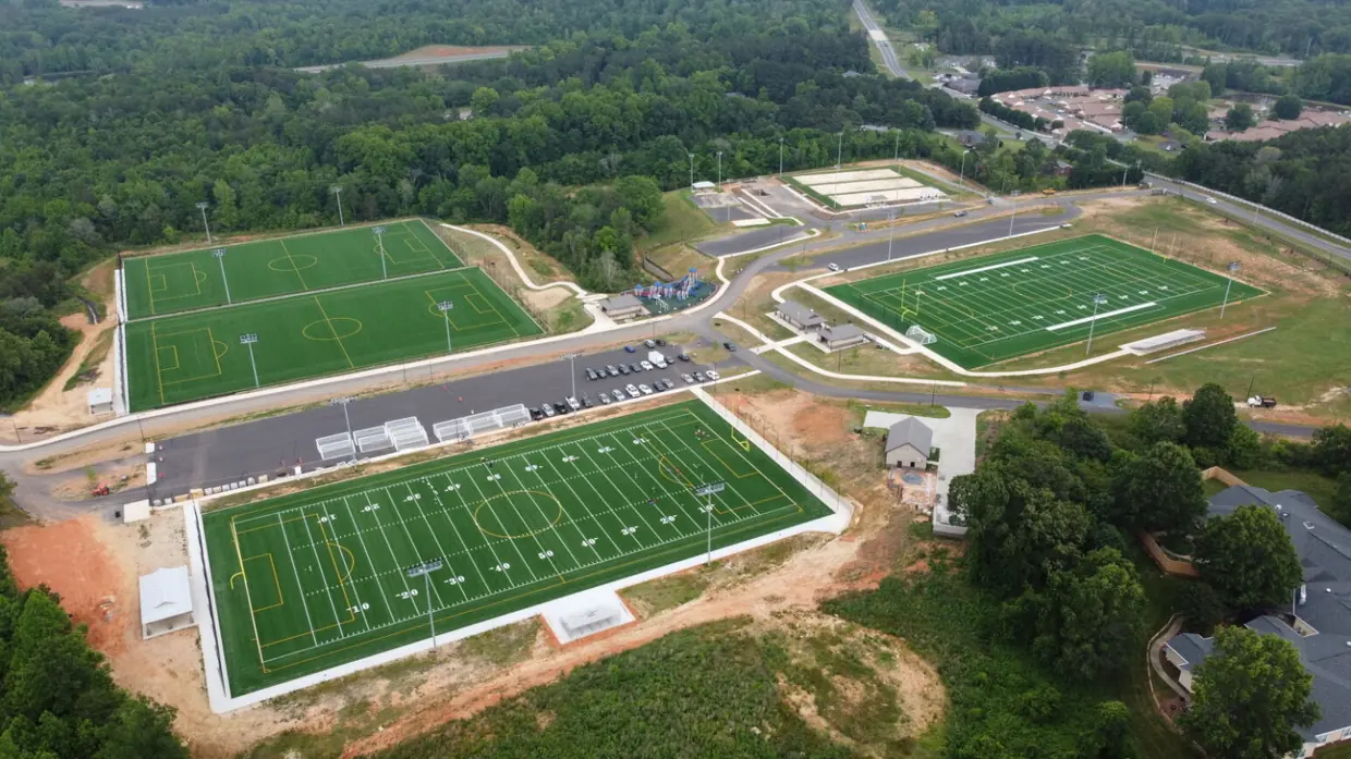 Aerial view of Cone Health Zoo City Sportsplex showing the multi-purpose turf fields, parking and access roads.